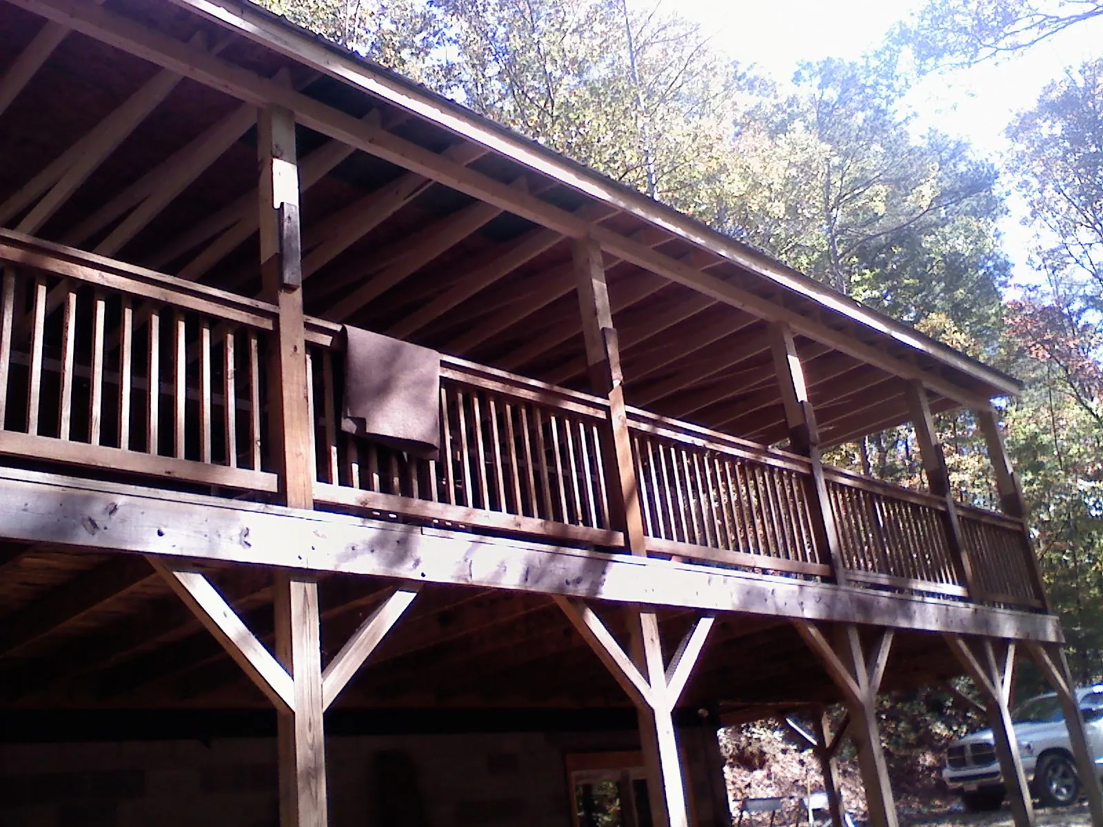 Timber framing under a new elevated porch and deck in Wolf Creek
